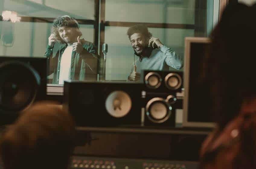 Band in studio making a record