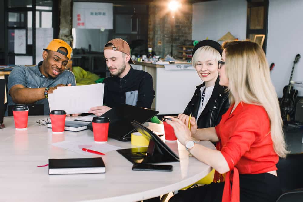 Four young students studying at college