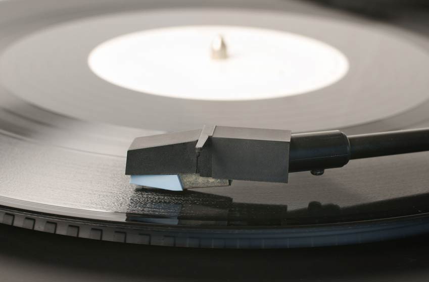 Vinyl record and record player stylus